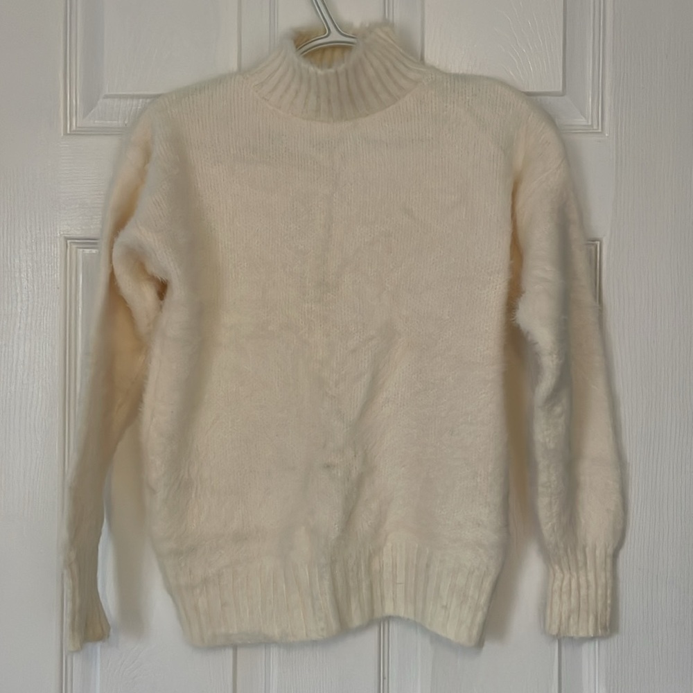 White fuzzy sweater
